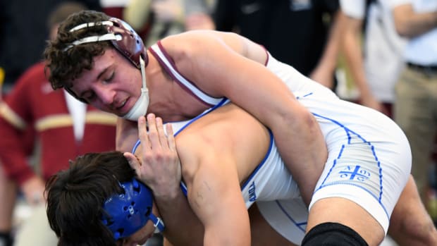 Lake Gibson senior Gianni Maldonado defeats Kawayran Vazquez from Tampa Jesuit to give the Braves the FHSAA Class 2A Duals wrestling state championship on Saturday at the FHSAA Duals wrestling state championships at Osceola High School. 